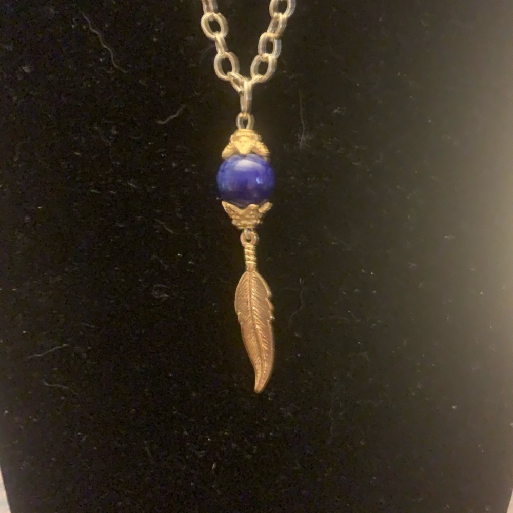 Gold chain with feather